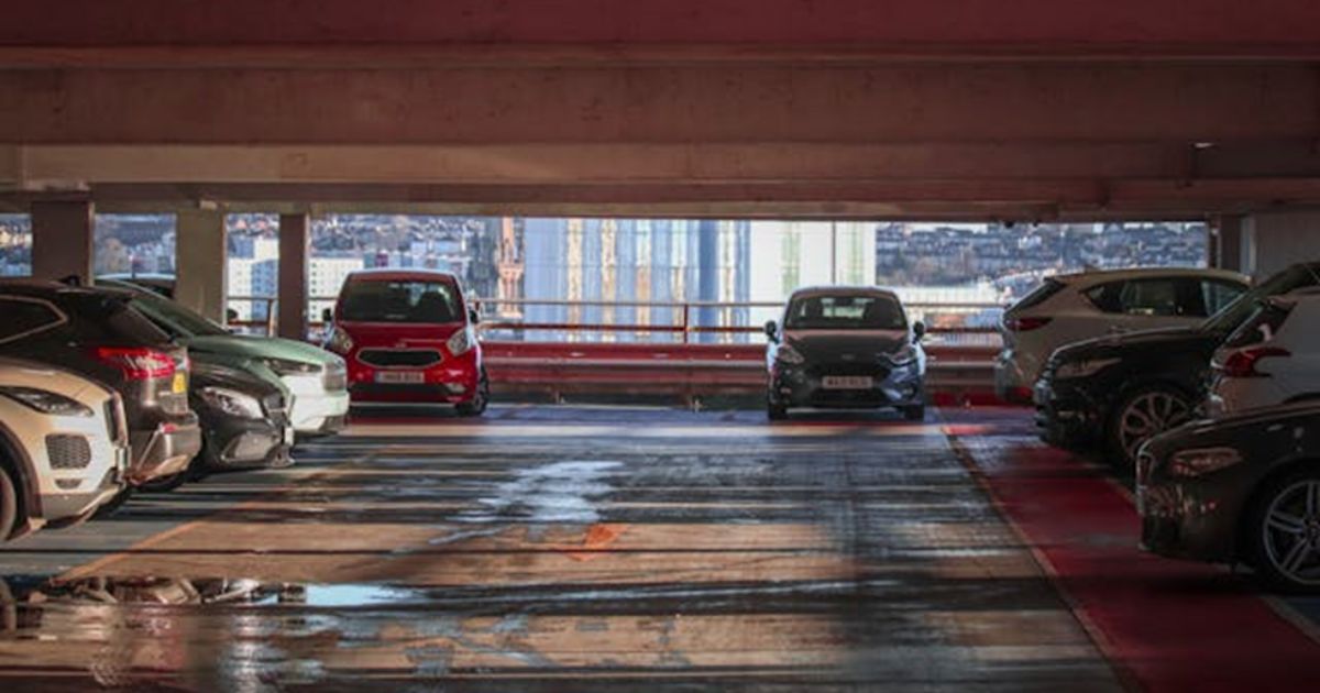Several cars parked in the garage