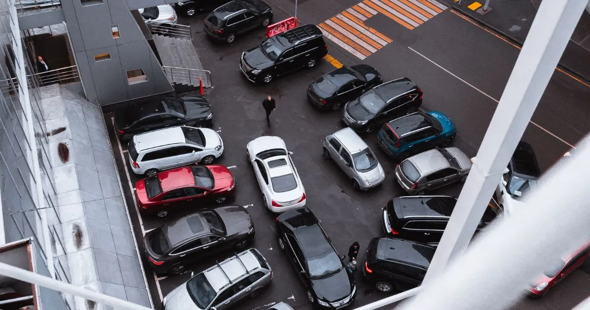 A Small Round Shaped Parking Lot With Multiple Parked Vehicles